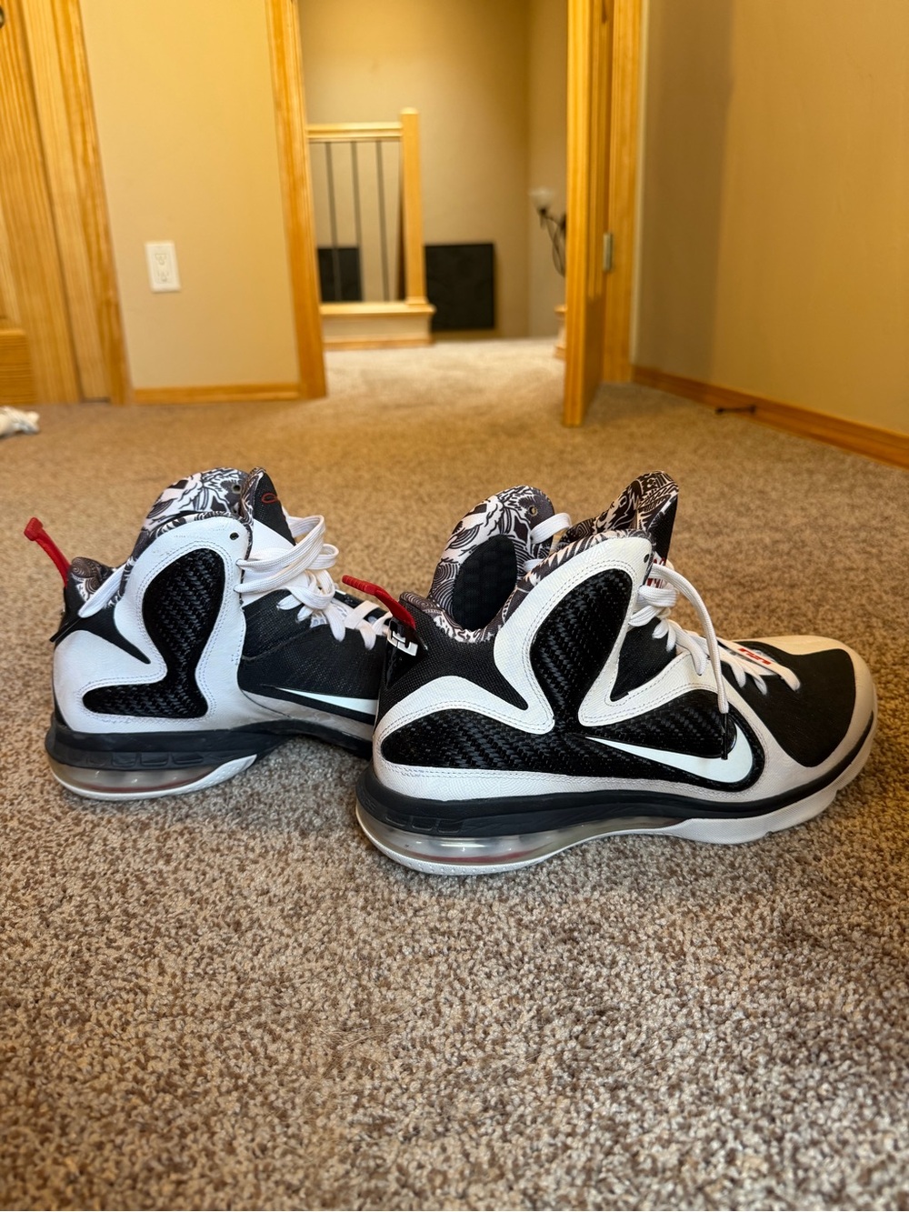 Nike Black and White High-Top Basketball Sneakers with Red Accent